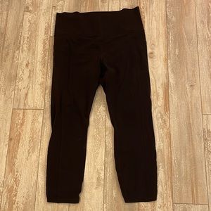 ATHLETA Black Leggings with Slit Cut on back legs